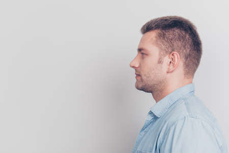 Close up portrait of good-looking man stand isolated on light grの写真素材