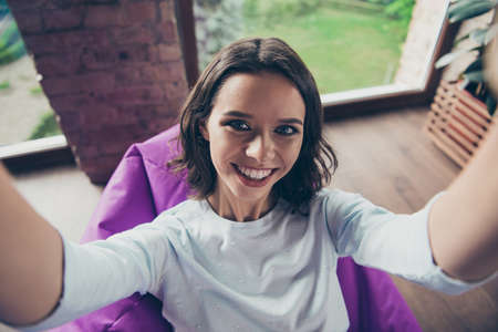 Self-portrait above high angle view of nice cute toothy adorable