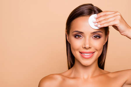 Excited brunette hair lady use micellar water and circle white pの写真素材