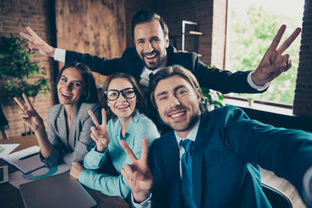 Self-portrait of four stylish elegant classy cheerful funny posiの写真素材