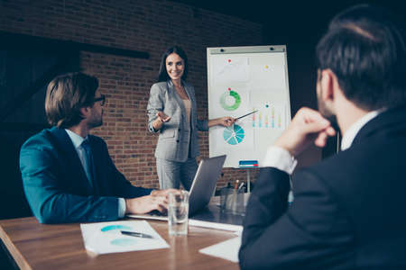 Lady in trendy style stylish formalwear stand indoor loft interiの写真素材