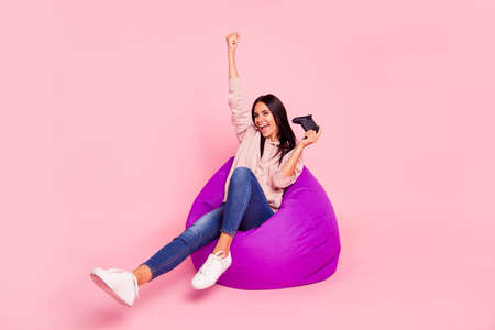 Full legs body size leisure lifestyle lady with her raised fist