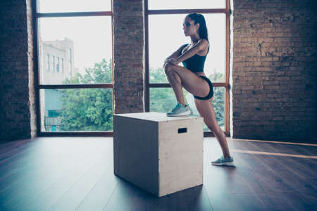 Profile side view of strong confident girl exercisingの写真素材