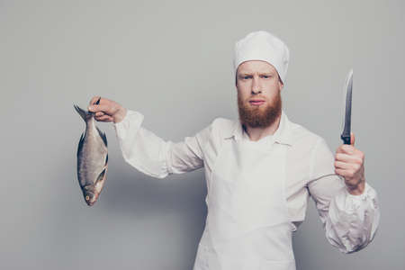 Portrait of mad attractive handsome serious fury butcher guy holの写真素材