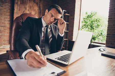 Low below angle view portrait of elegant imposing classyの写真素材