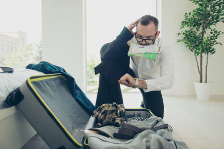 Close up portrait of nervous attractive handsome biting ticketsの写真素材