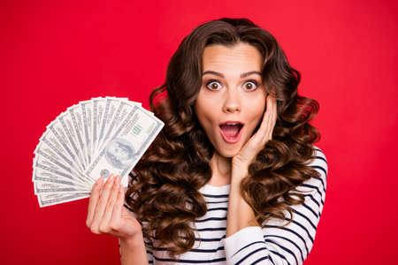 Portrait of nice amazed wondered attractive cheerful positive wavy-haired lady wearing striped...