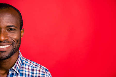 Cropped close-up half-face portrait of nice handsome attractive cheerful positive guy wearing...