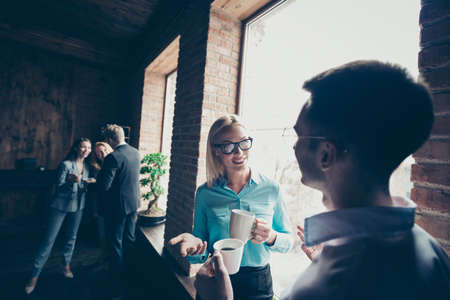 Close up photo of people having rest at work break drinking coffee