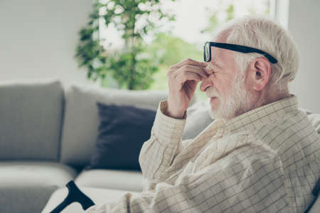 Profile side view portrait of tired bored annoyed stylish old maの写真素材