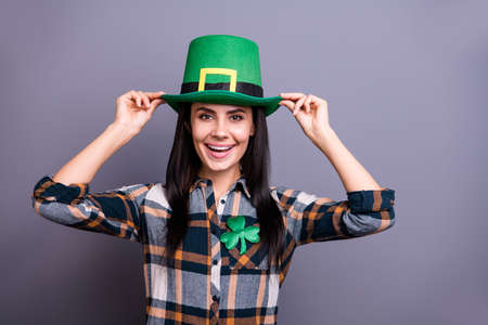 Portrait of her she nice cute attractive lovely cheerful cheery positive lady in checked shirt isolated over gray pastel backgroundの写真素材