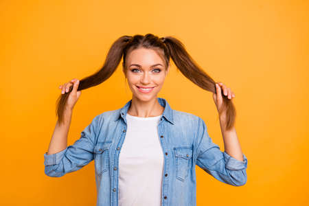 Young women holding hair and smileの写真素材