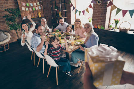 Close up photo of gathered family at home