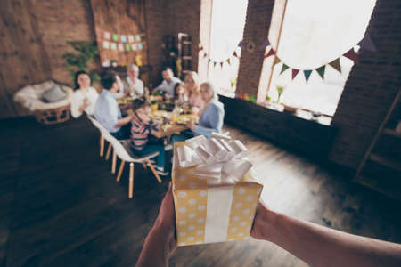 Close up photo of gathered relatives at home