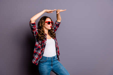 Close up portrait of an amazing  lady, hands up, on her  red dark bright summer glasses, wearing...