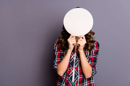 Close up portrait of an amazing  lady, empty card in hands, wearing casual checkered shirt isolated...