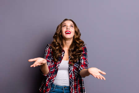 Portrait of nice-looking cute attractive charming pretty cheerful cheery funny wavy-haired lady looking up catching praying isolated over gray pastel purple backgroundの写真素材