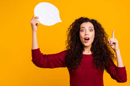 Portrait of nice cute attractive cheerful cheery wavy-haired lady holding in hand white card copy...