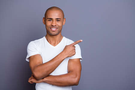 Close up photo attractive strong healthy masculine dark skin he him his macho bald head arm finger...