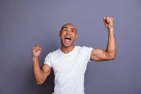 Close up photo strong healthy dark skin he him his macho bald head mouth opened in delight yell...