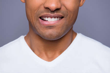 Close-up cropped portrait of his he nice handsome attractive well-groomed content guy wearing white shirt beaming teeth isolated over gray violet pastel backgroundの写真素材