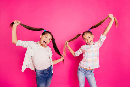 Close up photo two pretty little age girls holiday having fun funky childish glad tongue out mouth...