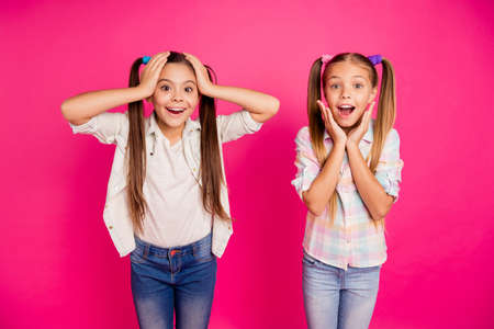 Close up photo two little age girls hands arms head cheeks yell scream shout big fortune lottery...