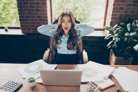 Close up photo beautiful she her business lady hold head oh no loser check start-up watch diagram lost lose money income earnings fail unbelievable sit big office chair wearing formal wear suit shirtの写真素材