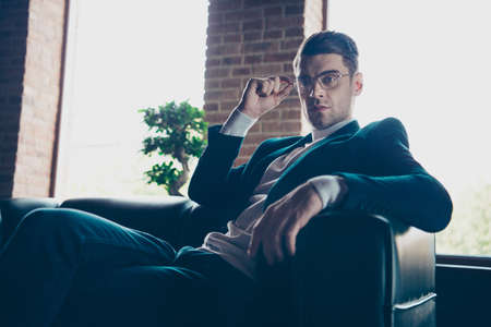 Portrait of his he nice stylish trendy handsome guy company founder shark specialist waiting appointment meeting partner at industrial loft interior workplace workspaceの写真素材