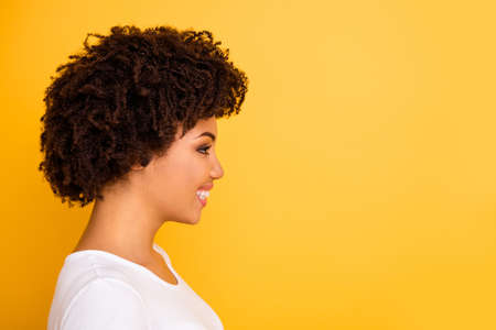 Close up side profile photo beautiful amazing she her dark skin lady smiling look empty space laugh...