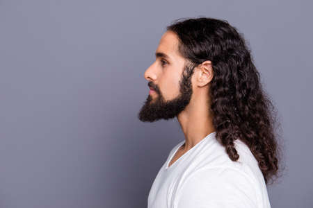 Close-up profile side view portrait of  cool well-groomed attractive peaceful calm wavy-haired guy mustache isolated over gray violet purple pastel background.の写真素材