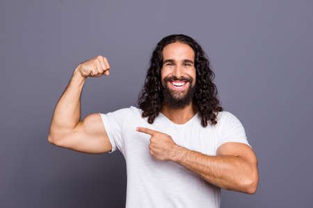 Portrait of his he nice cool groomed attractive cheerful cheery glad wavy-haired guy pointing finger...