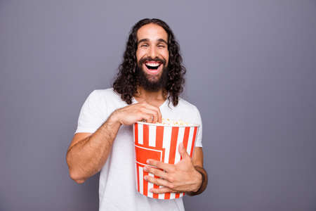Portrait of  nice groomed attractive cheerful cheery wavy-haired guy watching comedian video isolated over gray violet purple pastel background.の写真素材