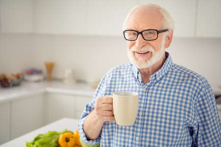 Close up portrait cheer grey haired he his him grandpa hot beverage hand arm look window ponder...