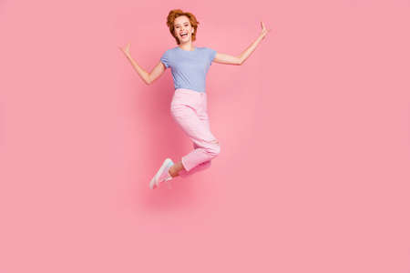 Full length body size view of her she nice cute charming attractive lovely cheerful cheery feminine girl wearing casual rejoicing having fun isolated on pink pastel backgroundの写真素材