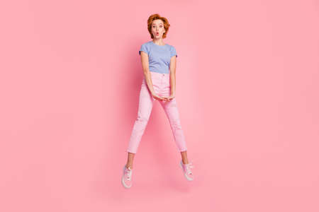 Full length body size view of her she nice cute charming attractive winsome lovely cheerful funky girlish girl wearing casual having fun isolated on pink pastel backgroundの写真素材