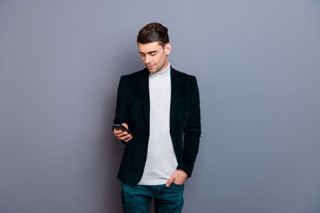 Portrait of his he nice cute attractive bearded cheerful guy wearing velveteen blazer using new...