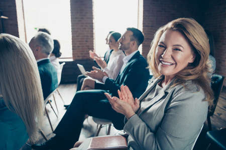 Profile side view of nice classy stylish trendy forum participants listening to report finance result company sales earnings educative classes at industrial loft interior work place spaceの写真素材