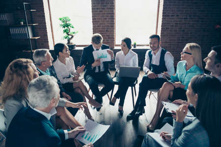 Nice stylish elegant classy top sharks sitting on chairs in circle discussing finance plan data...