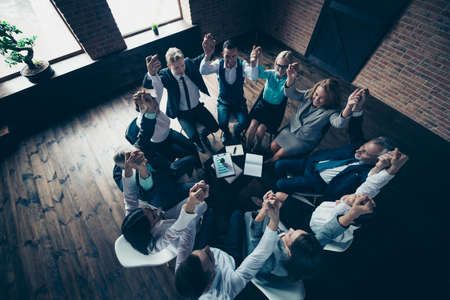 Close up top above high angle view photo business people round circle sit she her he him his hold...