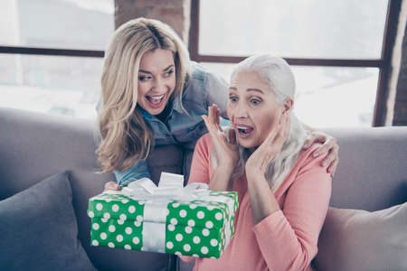 Close up photo two people she her ladies mom child grandmother grandchildren holiday giftbox not...