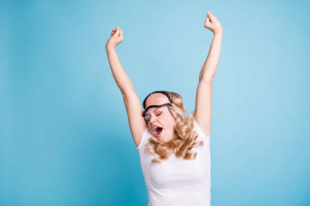 Portrait of her she nice-looking lovely attractive sleepy wavy-haired lady yawning stretching free time bedtime isolated over blue pastel backgroundの写真素材