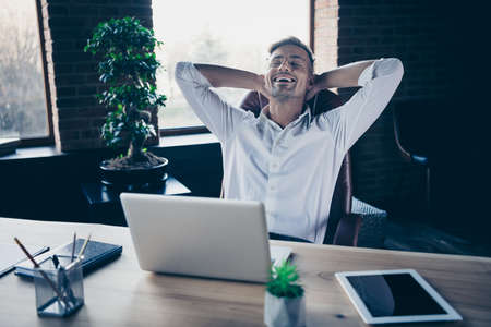 Close up photo handsome he him his macho guy got free minute hands arms behind head napping resting sleeping overjoyed notebook table sit office chair wear specs formal wear white shirtの写真素材