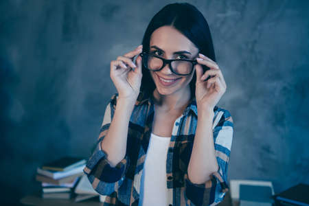 Close-up portrait of her she nice attractive charming lovely sweet adorable genius cheerful cheery brunette lady in checked shirt at industrial loft style interior work place stationの写真素材