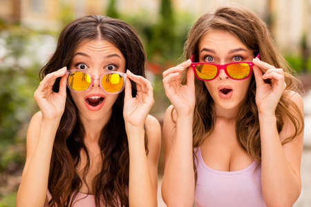 Close up photo beautiful pretty caucasian asian ladies best students impressed astonished incredible...