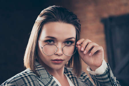 Close up photo head shot beautiful she her business busy lady ponder pensive contemplation mood deep thinking look candid eyes stand lean table office wear specs formal-wear checkered plaid suitの写真素材