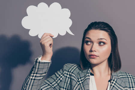 Closeup photo portrait of confident unsure uncertain thoughtful office lady in plaid checkered...