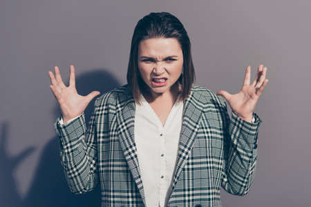 Closeup photo picture portrait of unhappy worried troubled showing her negative teeth she lady gesturing hands fingers isolated grey backgroundの写真素材