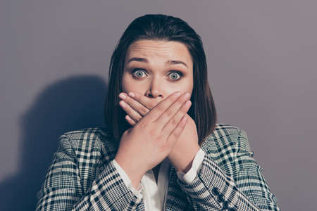Unpleasant smell breathing from mouth concept. Closeup photo portrait of unhappy sad upset scared she her lady holding palms arms near mouth stop talking isolated grey backgroundの写真素材