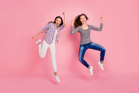 Full length body size view photo of lucky luck millennial ladies raising fists screaming yes yeah...